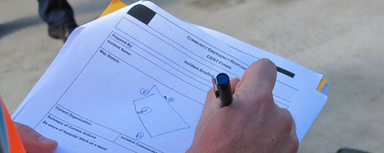 Photo of CERT member filling out paperwork