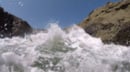 Video thumbnail image showing turbulent water splashing around the camera